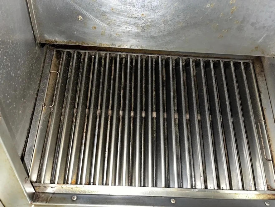 Baffle filters installed in a kitchen hood after cleaning