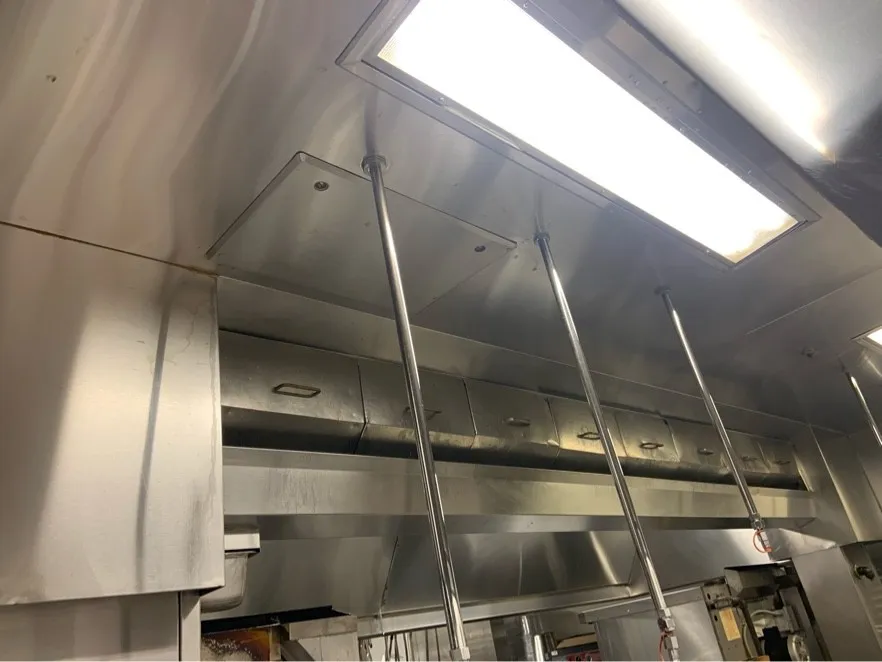 Cafeteria exhaust hood with clean filters and lights