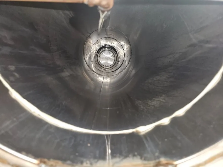 Looking up a round kitchen exhaust duct after steam rinsing