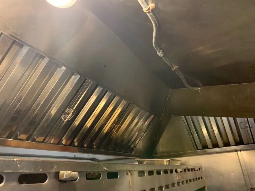 Row of baffle filters reinstalled in a clean hood